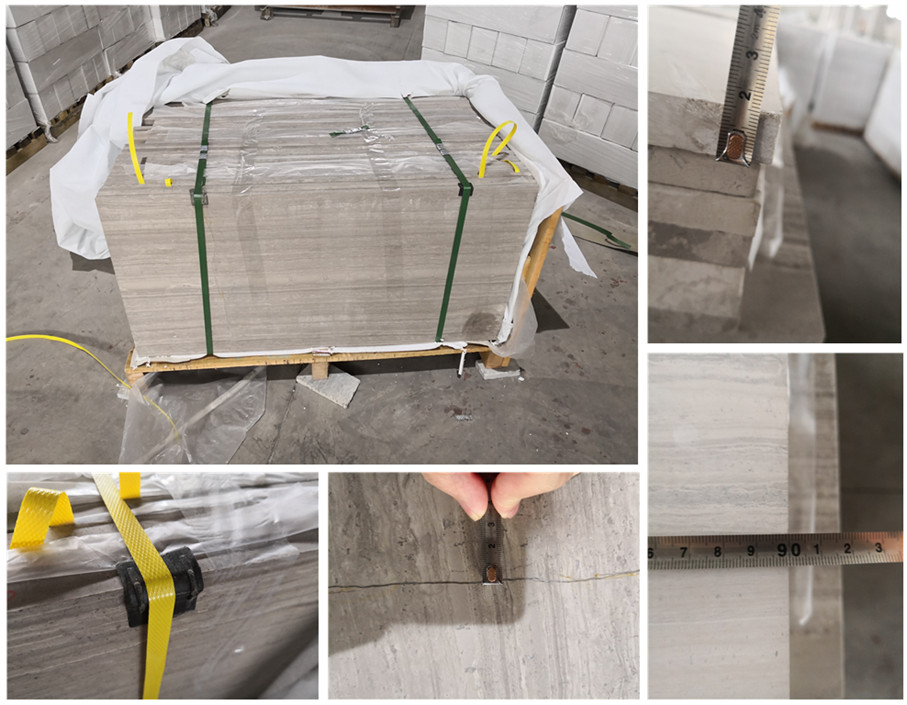 France Bourgogne Grey Limestone honed slabs inspection - packaged slabs with hands measuring dimensions