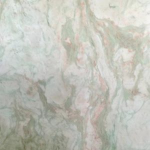 India Lady White Onyx close-up - green and pink veins on white onyx surface